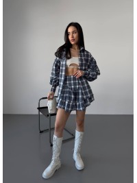 Жіночий костюм зі спідницею в клітку синього кольору 30784