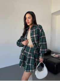 Жіночий костюм зі спідницею в клітку зеленого кольору 31070