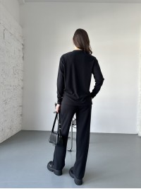 Жіночий прогулянковий костюм з трикотажу в рубчик чорного кольору 31198