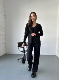 Жіночий прогулянковий костюм з трикотажу в рубчик чорного кольору 31198