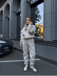 Жіночий теплий костюм з капюшоном бежевого кольору 34514