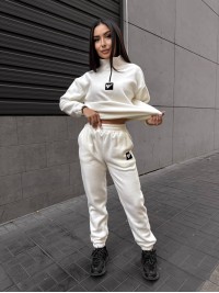 Жіночий костюм флісовий молочного кольору 35077