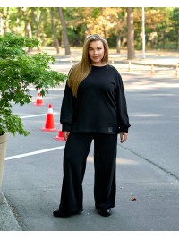 Жіночий прогулянковий костюм з теплого трикотажу чорного кольору 35573