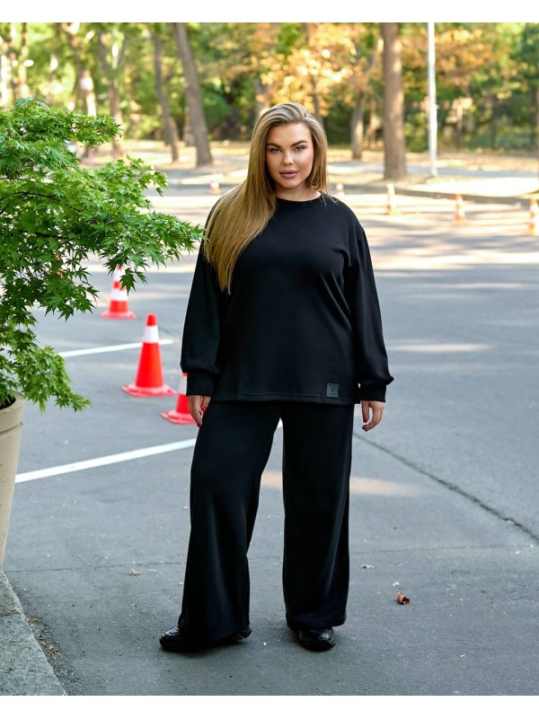 Жіночий прогулянковий костюм з теплого трикотажу чорного кольору 35573