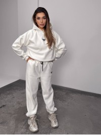 Жіночий костюм флісовий з капюшоном молочного кольору 35901