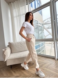 Стильні штани з накладними кишенями бежевого кольору 29056